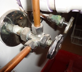 leaky valve beneath kitchen sink